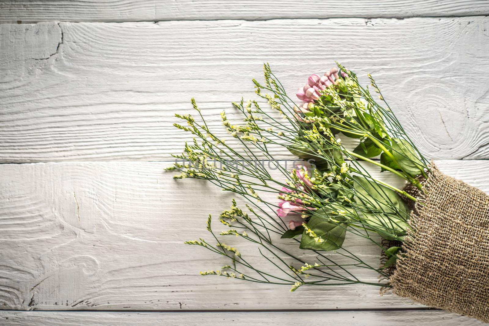 Summer flowers bouquet on the white wooden background top view by Deniskarpenkov