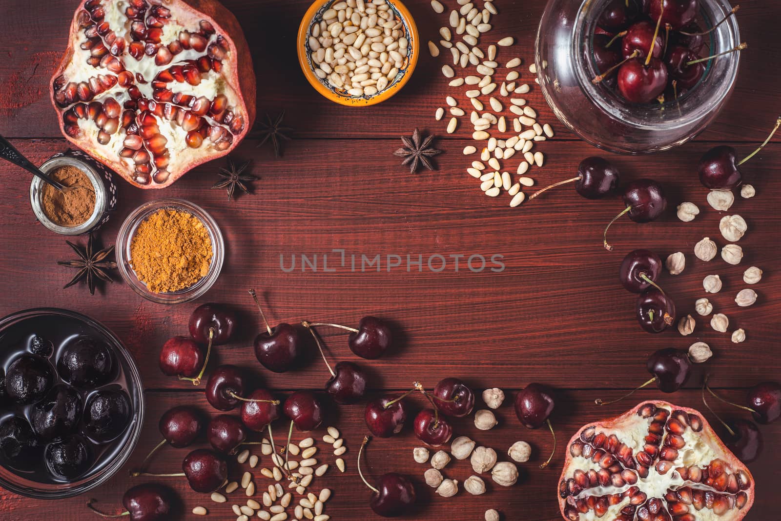Different fruit and spices on the red wooden table. Concept of oriental fruits top view by Deniskarpenkov