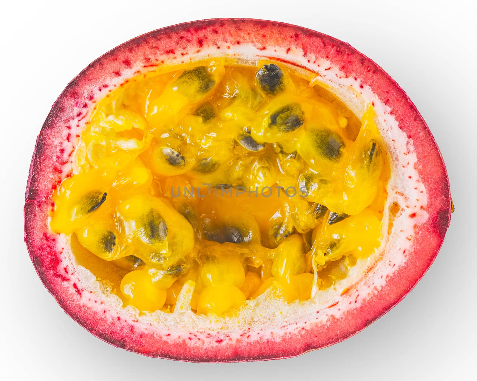 Half of passion fruit on the white background top view