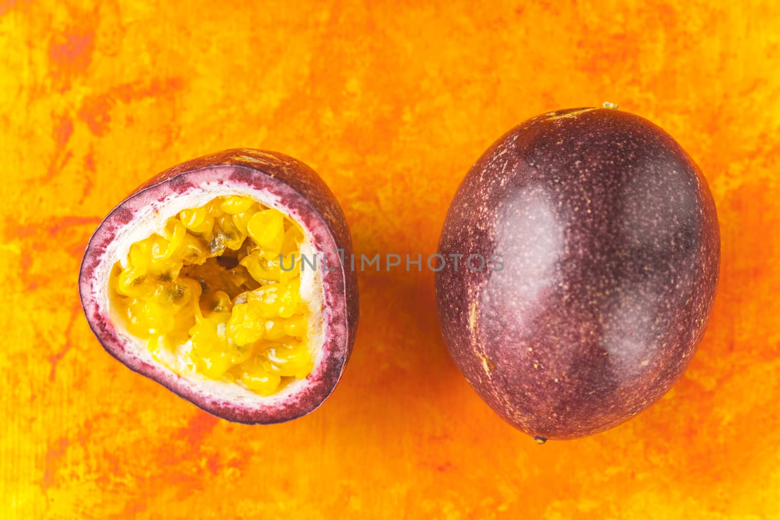 Passion fruit on the terracotta background top view by Deniskarpenkov
