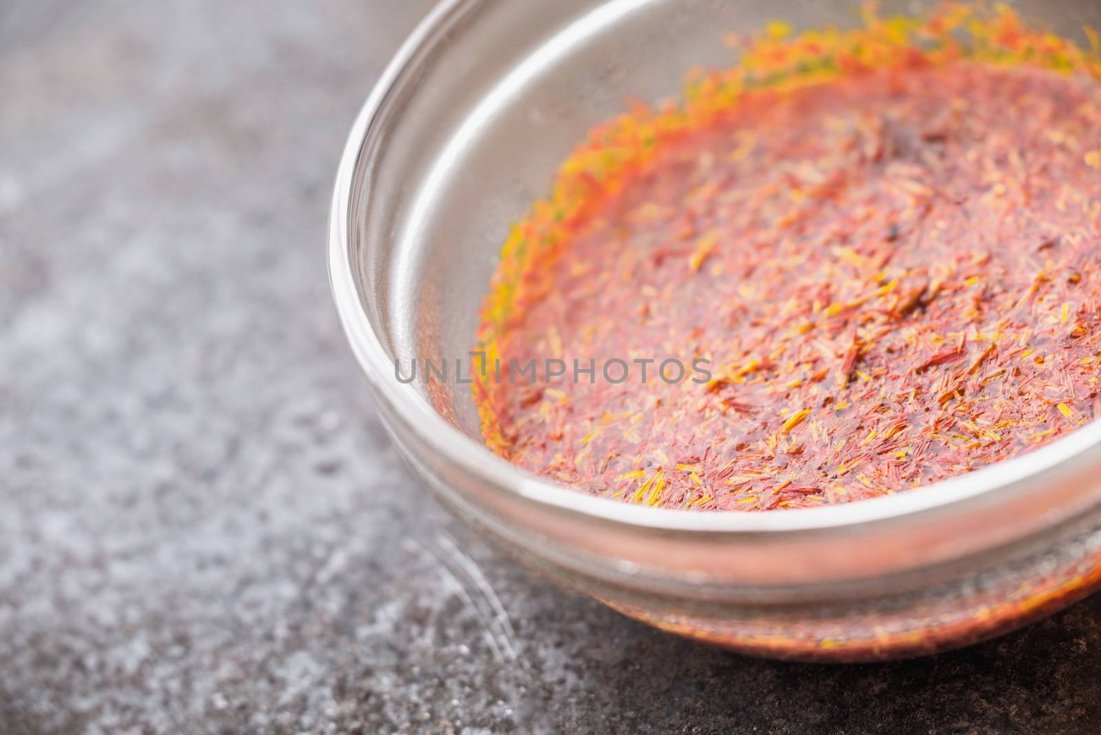 Saffron in the glass bowl  on the stone table