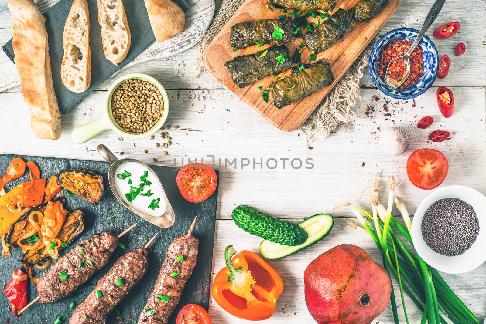 Kebabs with dolma, seasoning and vegetable. Concept Middle east , Asian and Caucasian cuisine top view by Deniskarpenkov