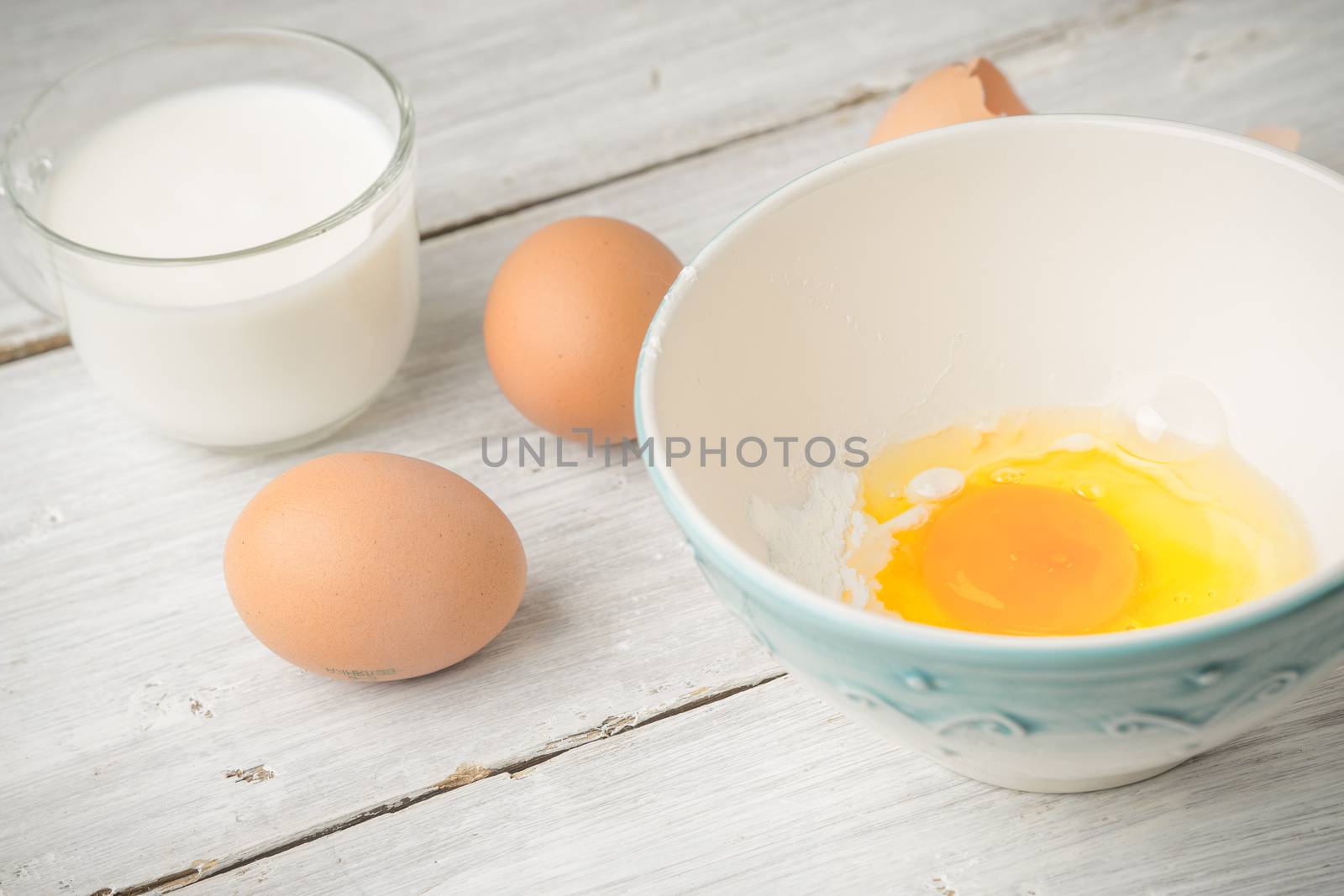 Eggs and yogurt on the white wooden table horizontal