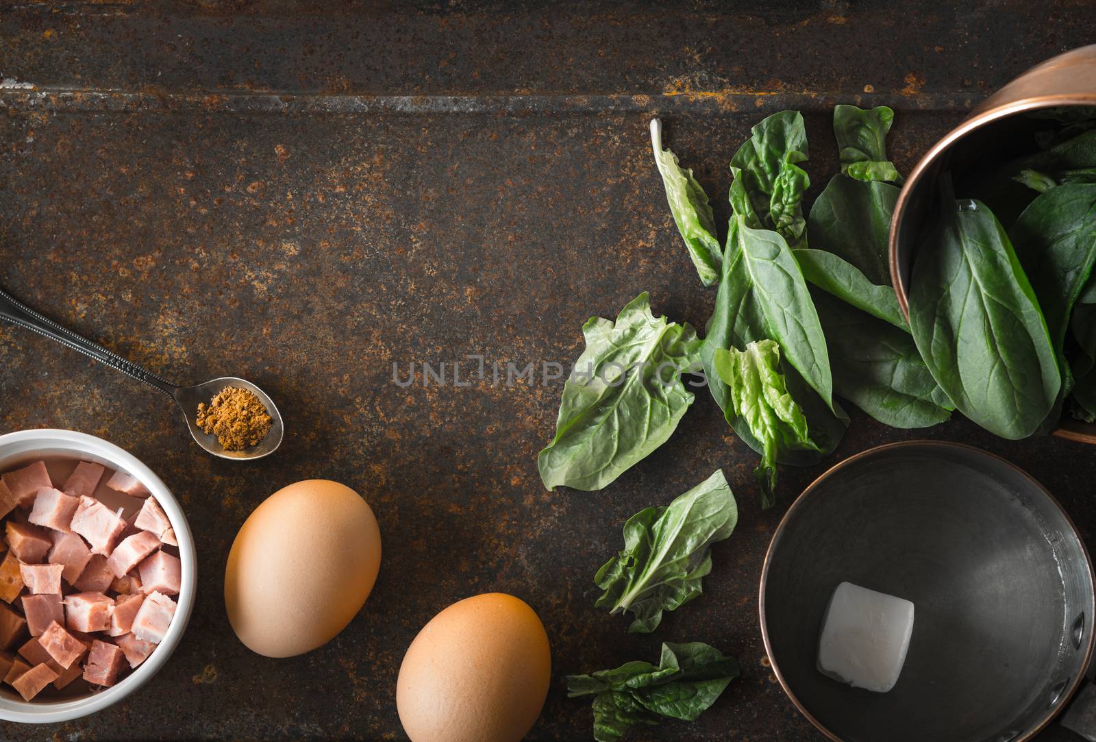 Ingredients for Florentine eggs with spinach on the rusty background top view