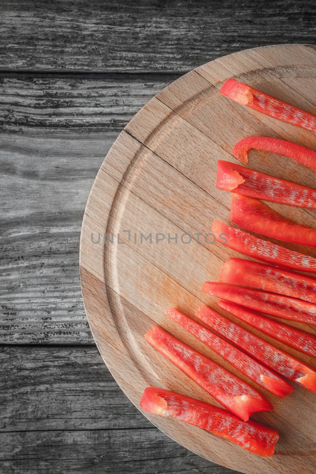 Sliced bell pepper on the wooden table vertical