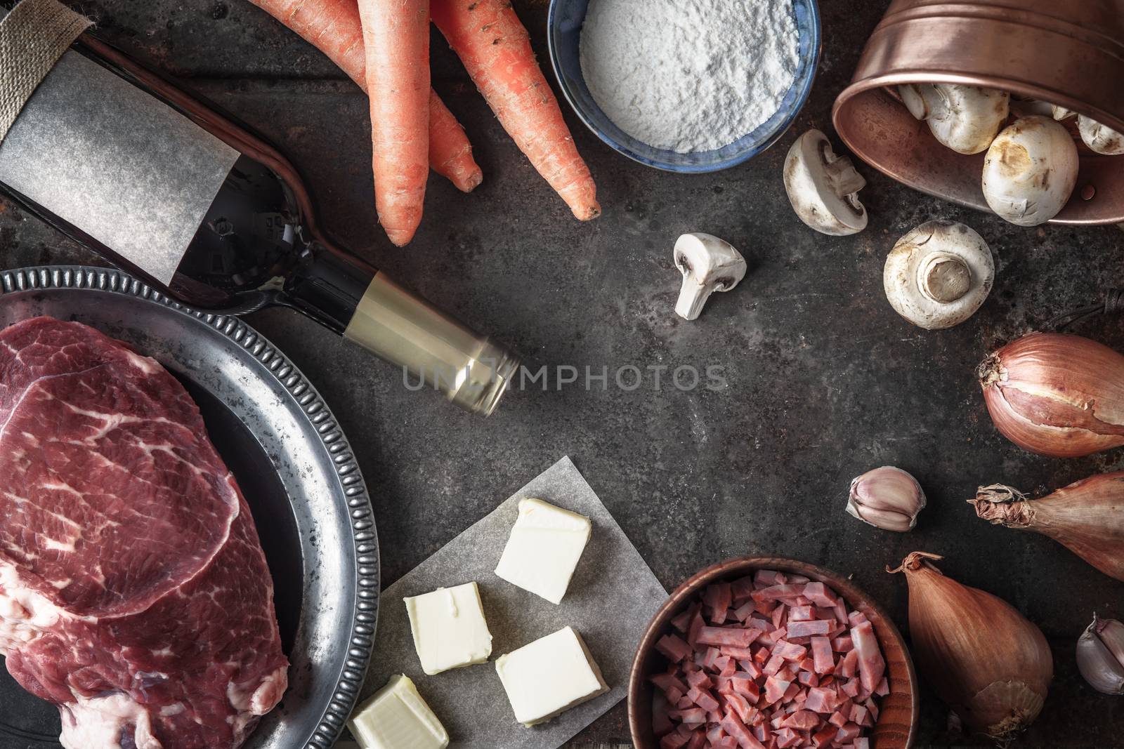 Ingredients for Boeuf Bourguignon on the old metal background top view
