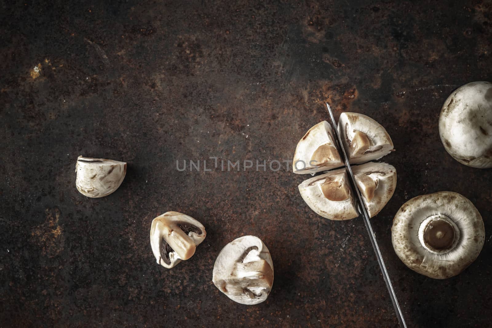 Cutting mushrooms on the old metal background by Deniskarpenkov