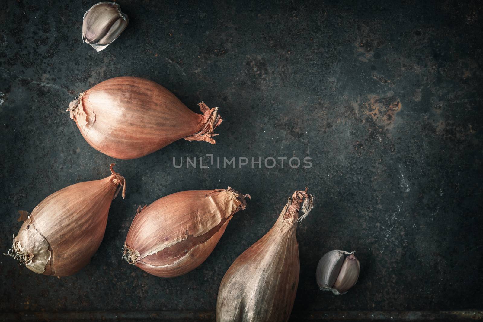 Shallots  on the  old metal background  top view by Deniskarpenkov
