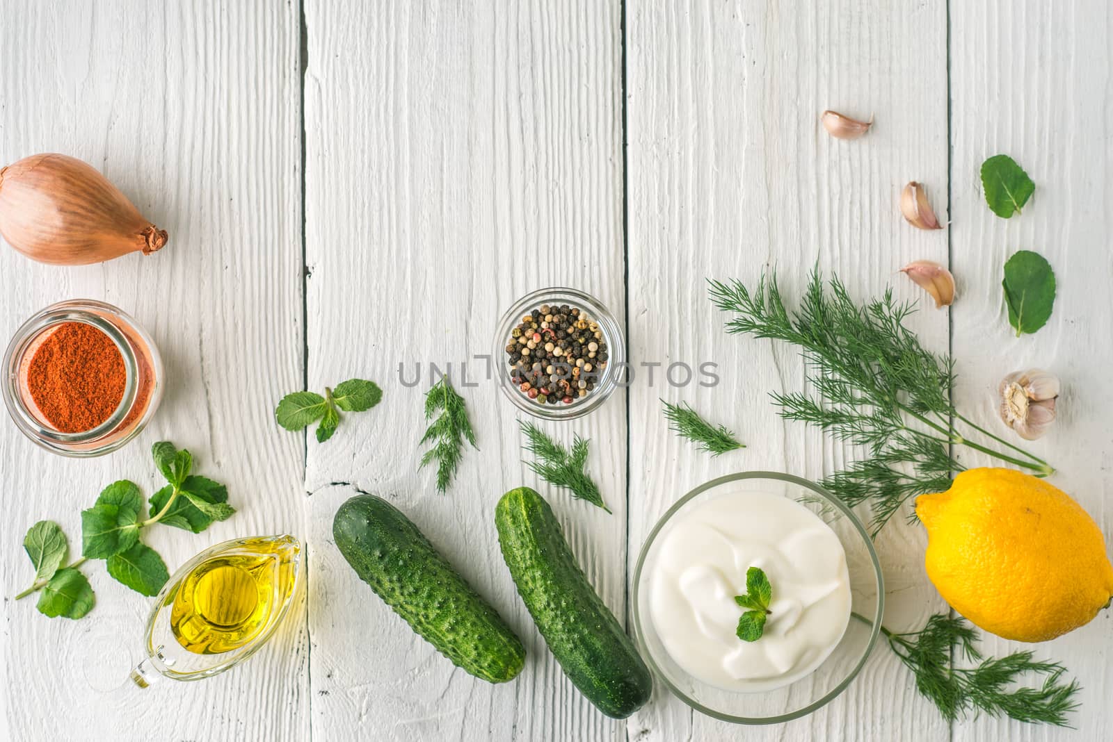 Ingredients for tzatziki on the white wooden table  top view by Deniskarpenkov