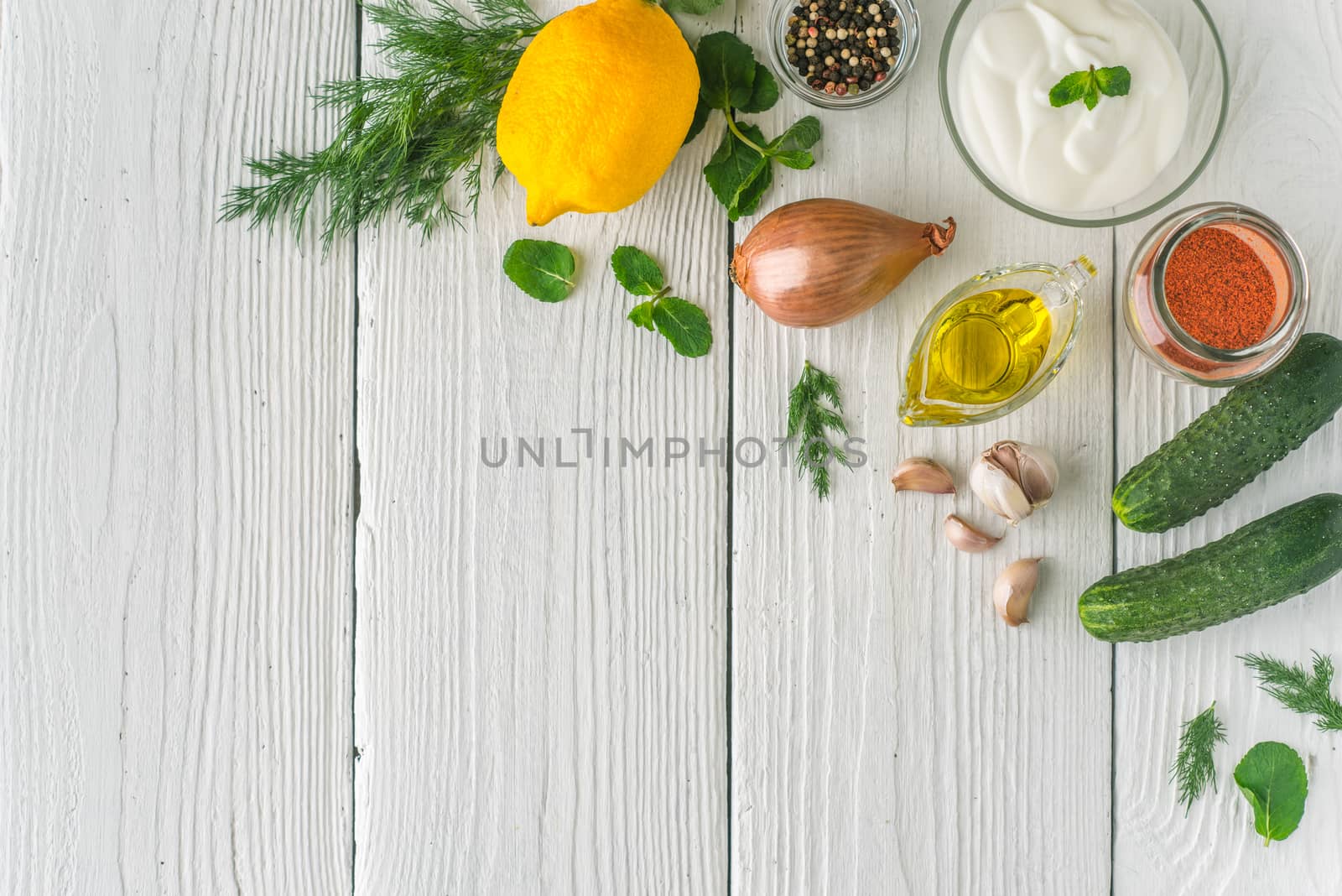 Ingredients for tzatziki on the white table  top view by Deniskarpenkov