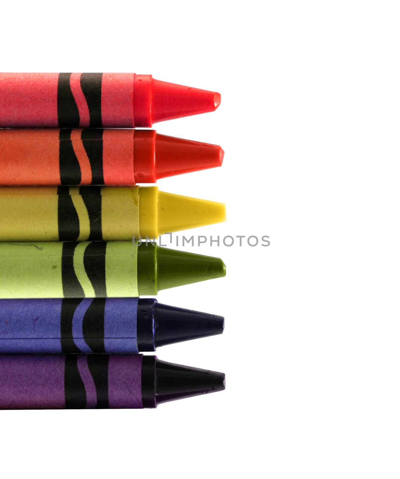 six used colored vax crayons form rainbow