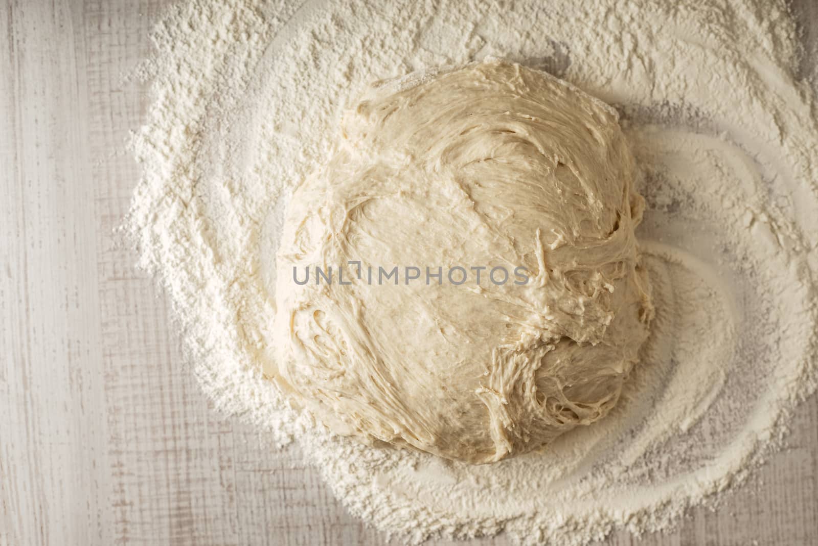 Dough on the table with flour top view by Deniskarpenkov