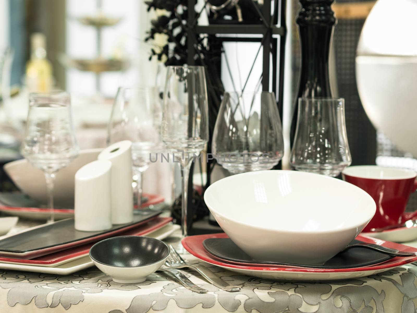 Set of dishes on table by fascinadora