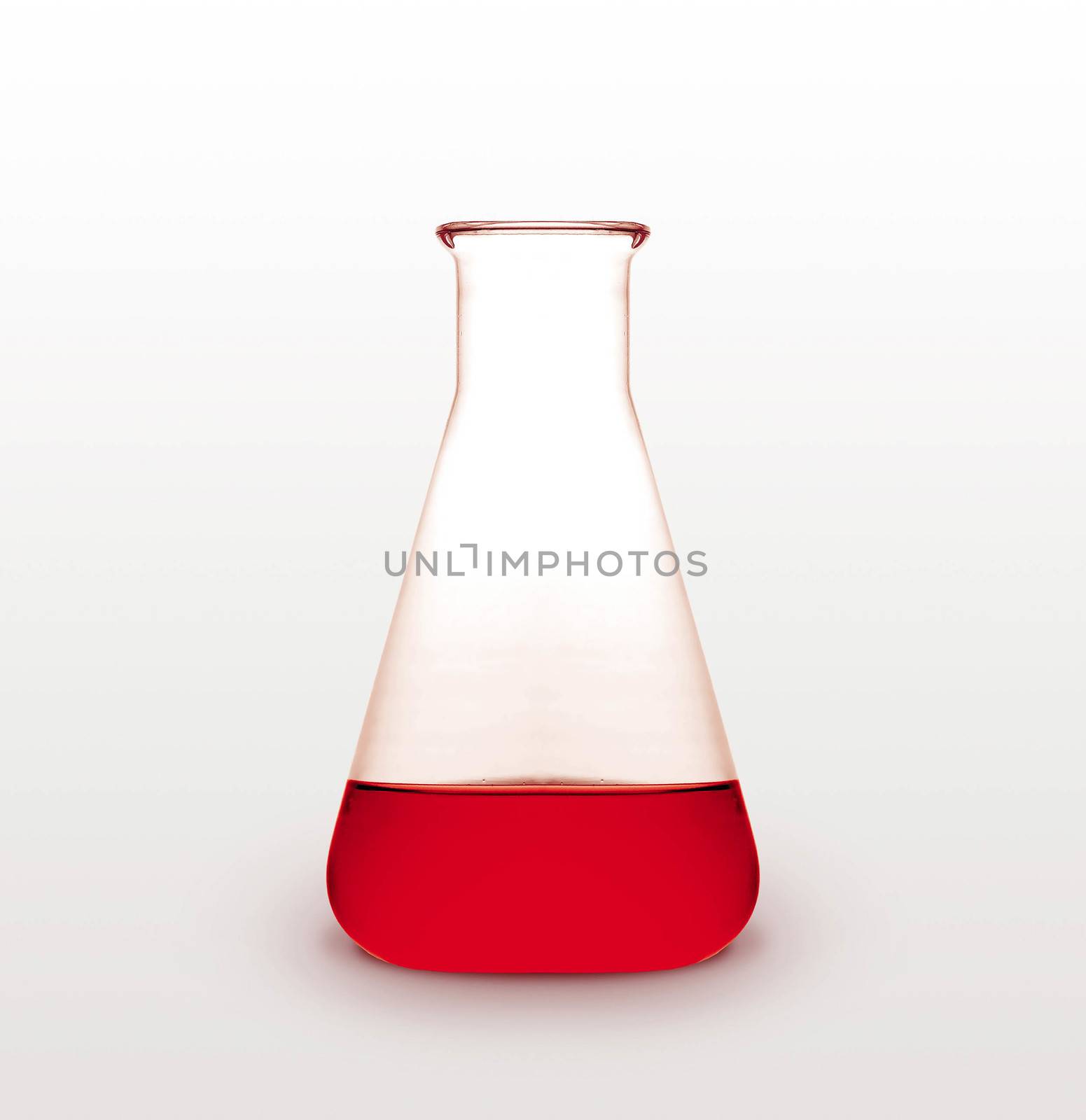 Triangle retort with red liquid on white background
