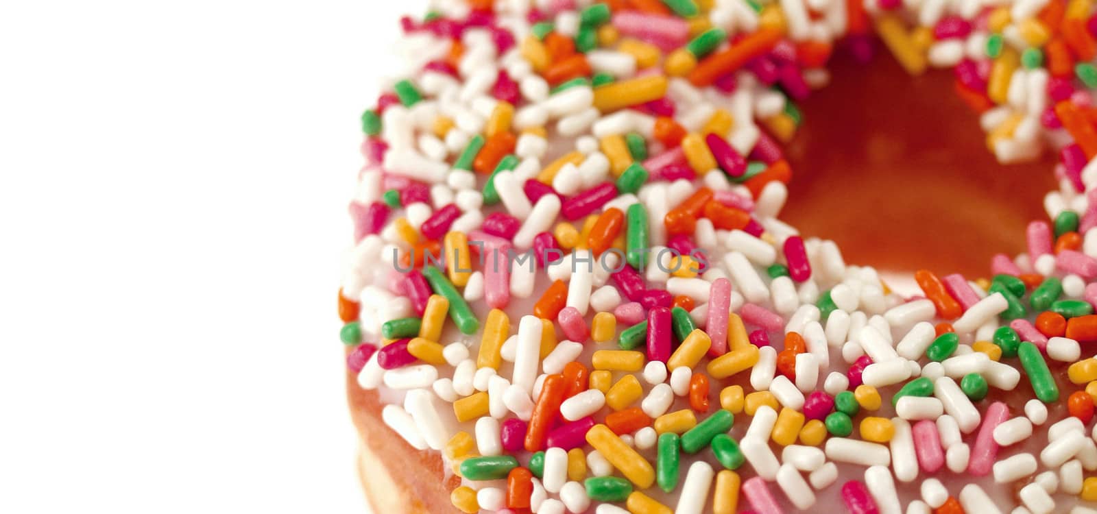 Pink Iced Doughnut covered in sprinkles isolated