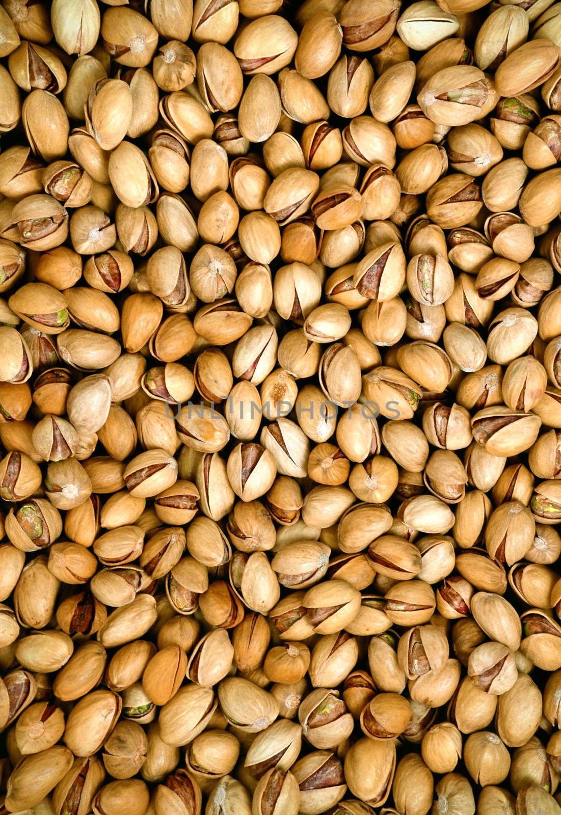 Pile of pistachio nuts close up