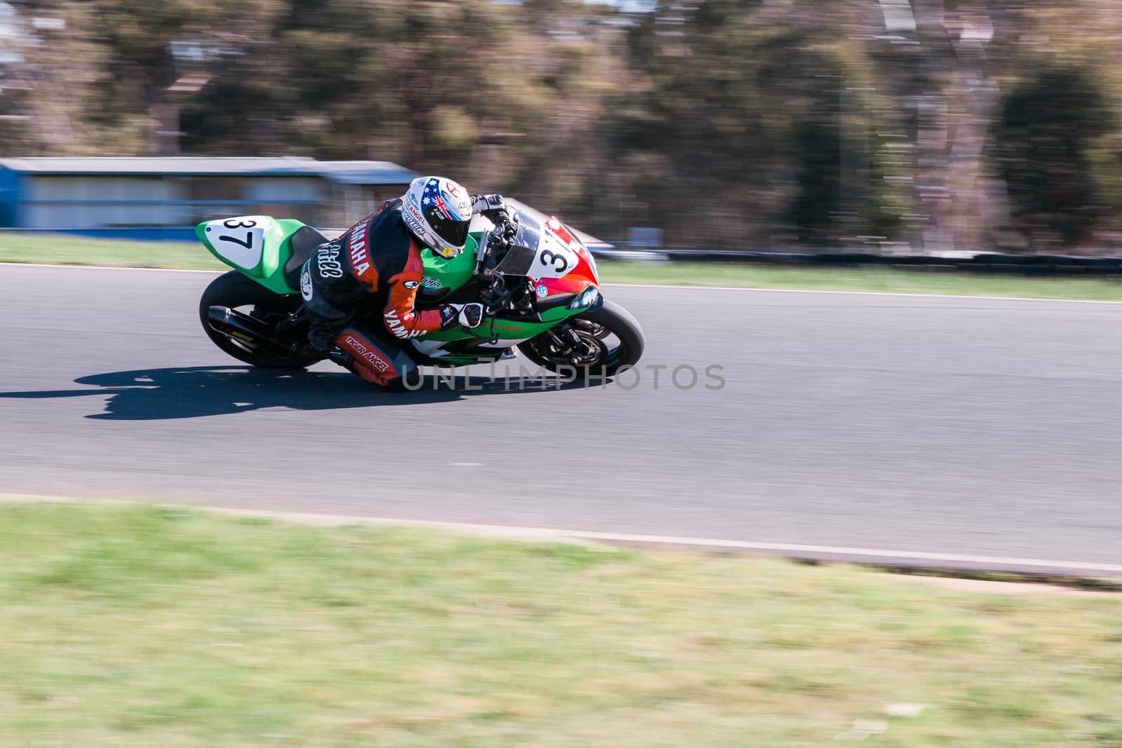 Motorcycle racers fight it out for the podium at the Hartwell Motorcycle Club Championship - Round 5 at Broadford Motorcycle Sports Complex in Victoria.