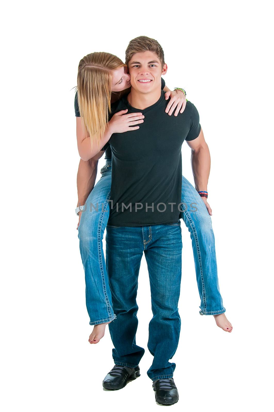 Loving young couple of bodybuilders playfully taking a break from a workout