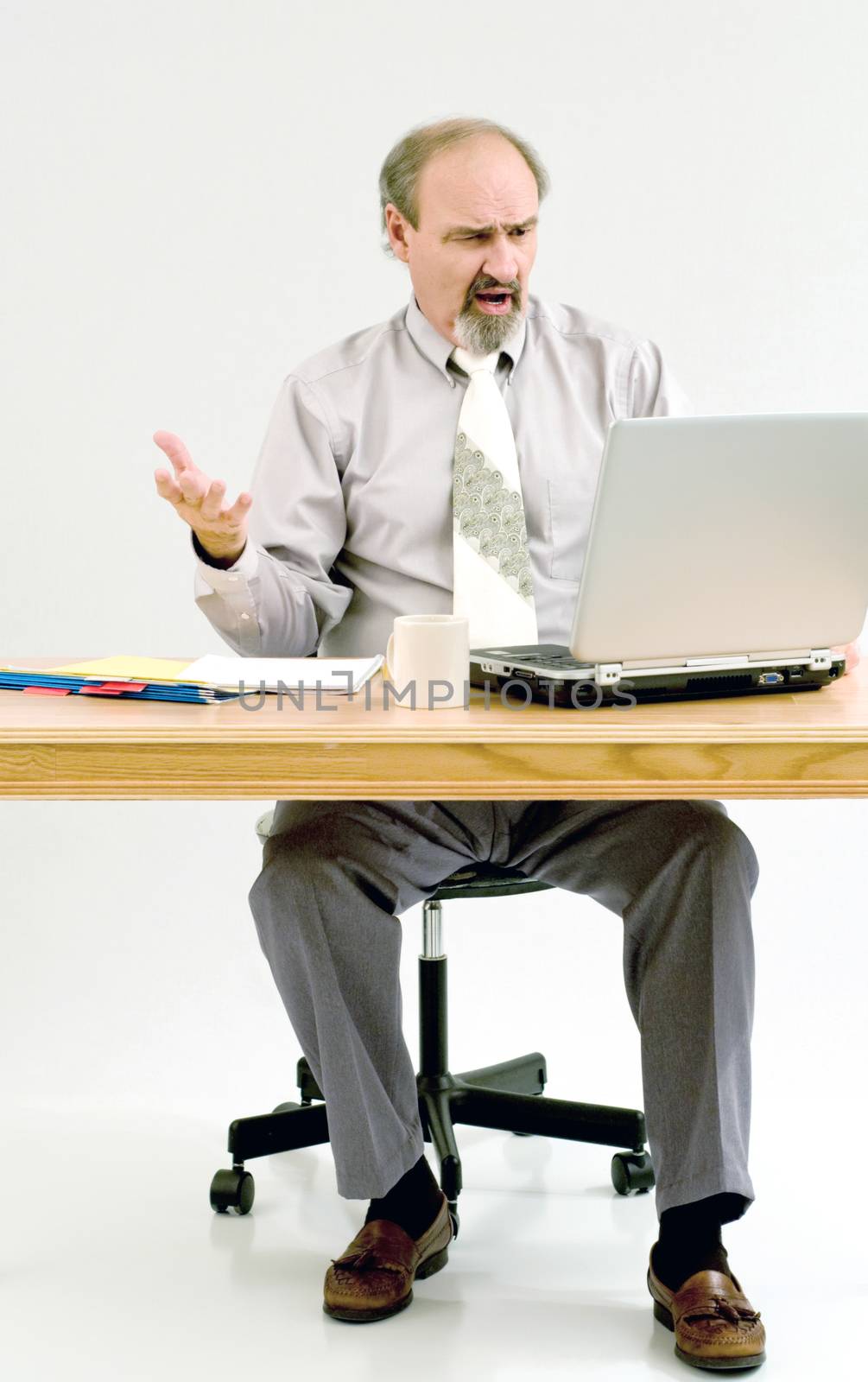 Businessman not liking the results he gets from computer calculations.