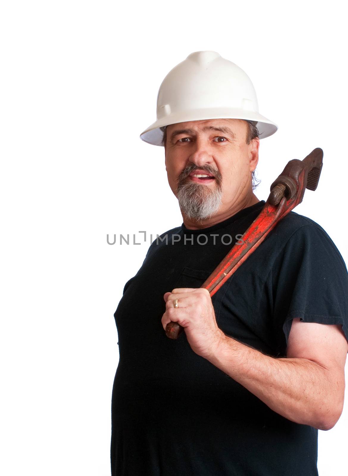Construction worker with a pipe wrench over his shoulder.