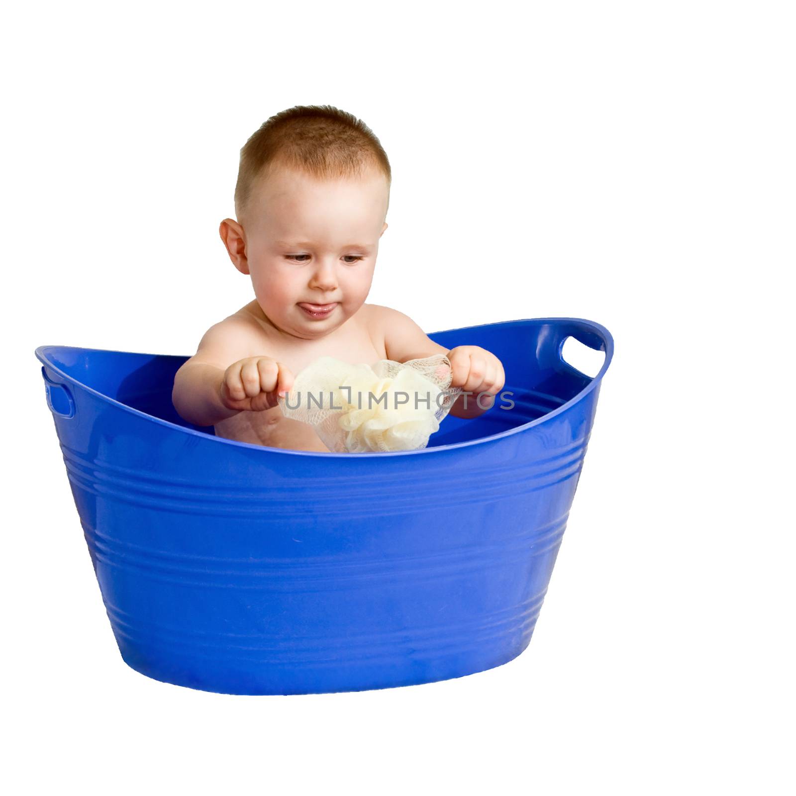 A baby boy playing in a plastic laundry basket. Isolated on white with a clipping path for easy removal