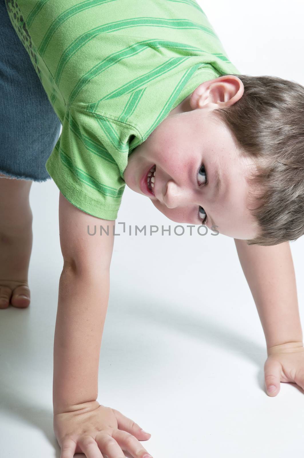 Baby boy playing with a big happy smile.