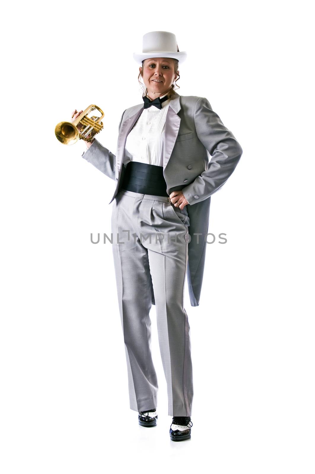 Pretty trumpet player in a top-hat and tuxedo against a pure white background.