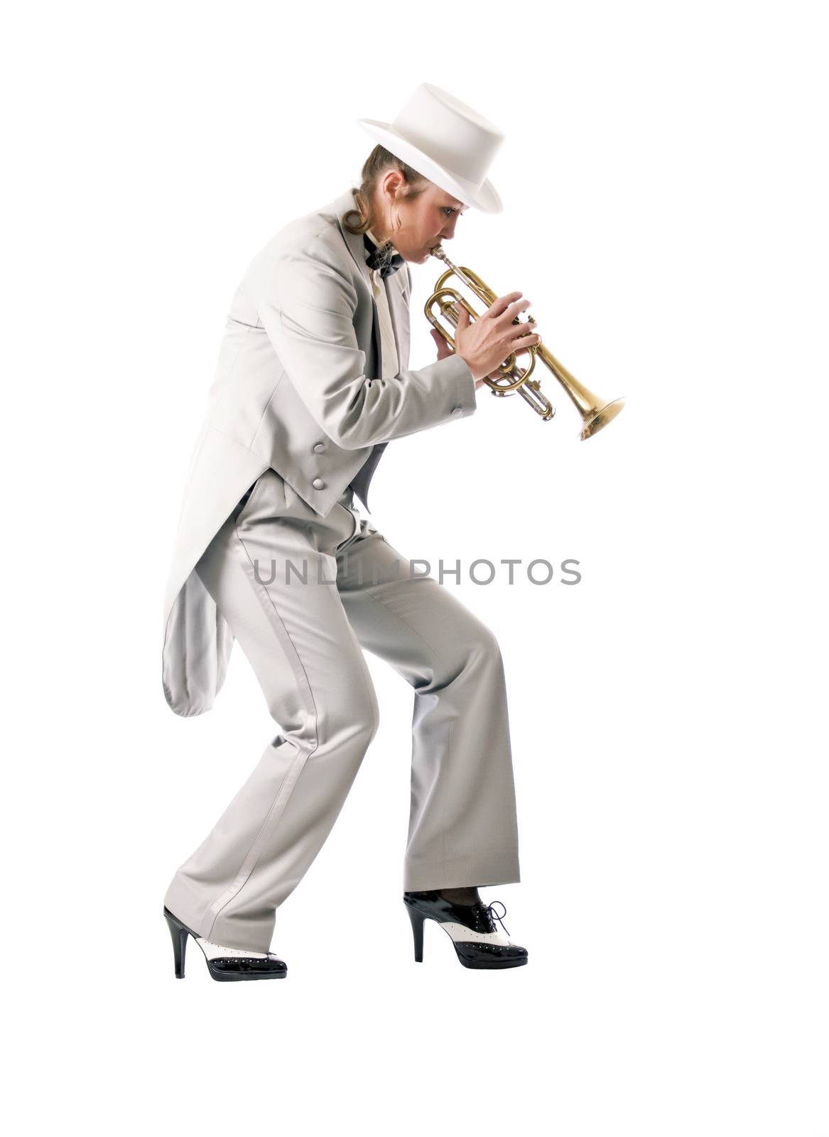 Pretty woman in tuxedo and top hat playing blues on a trumpet