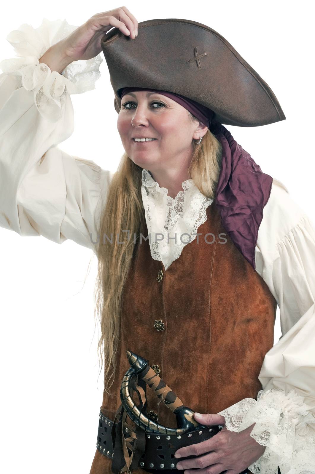 Dressed up for a Halloween costume party, a lady pirate adjusts the fit of her hat.