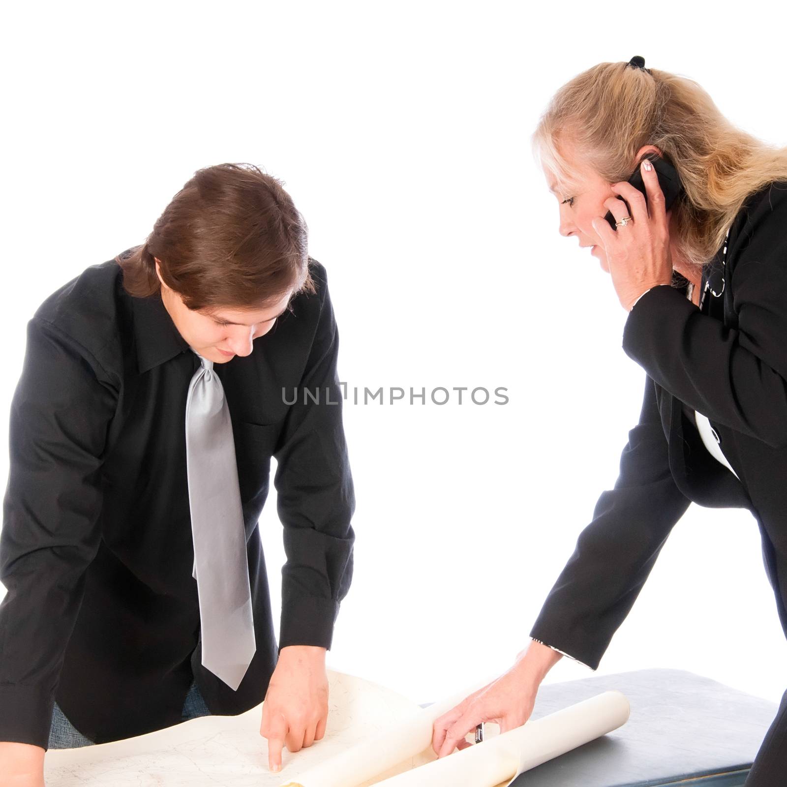 Woman manager shows a location on a topo map to a young colleague
