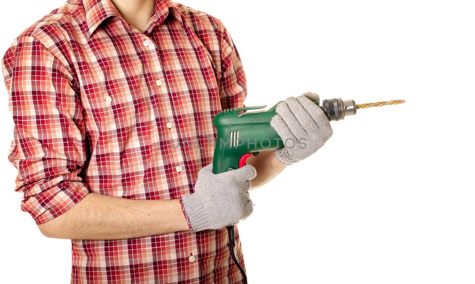 hands handling an electric drilling machine
