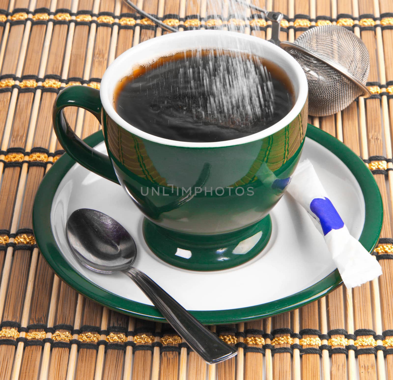 pour sugar into a mug