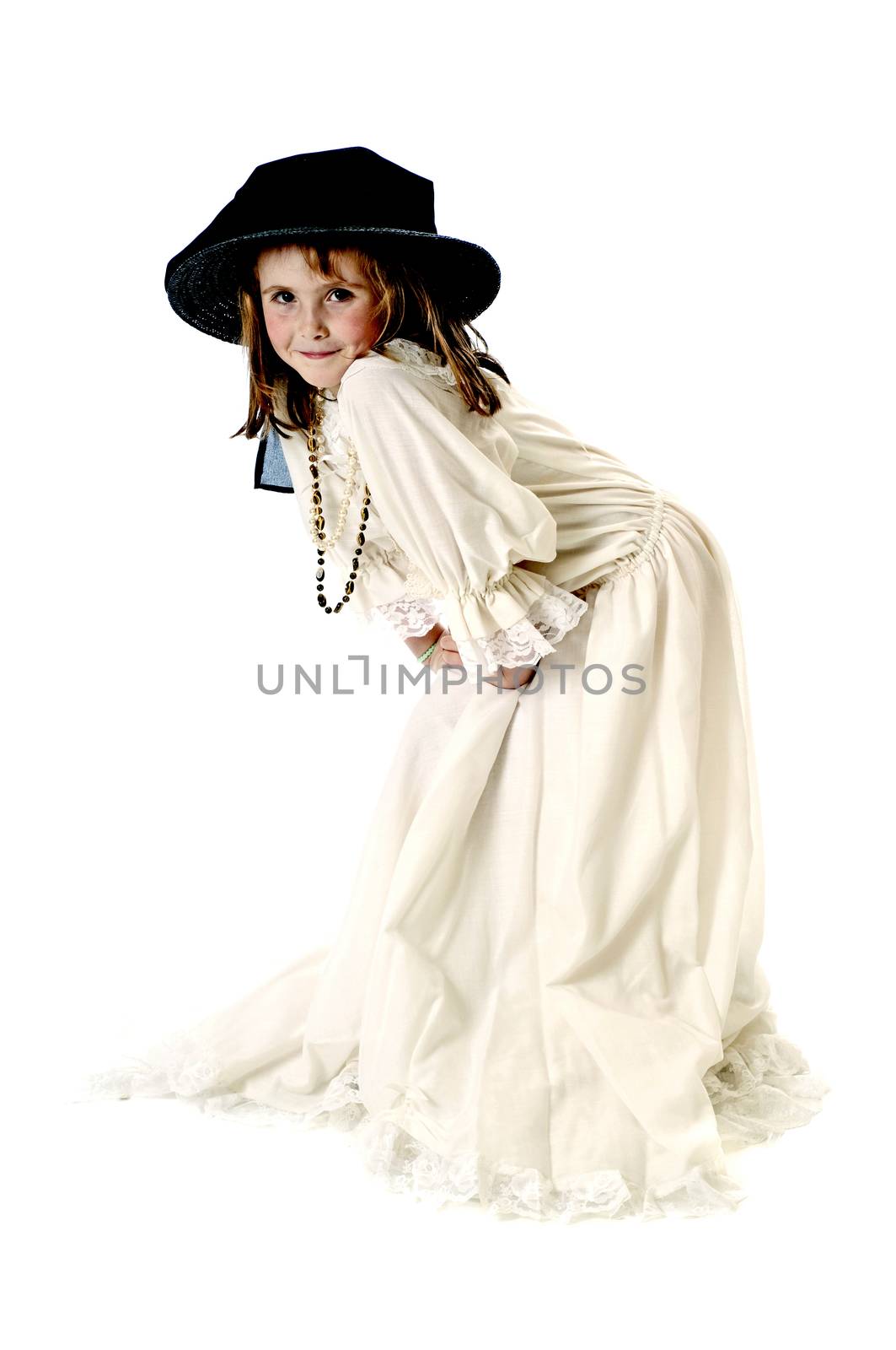 Little girl playing dress-up in her grandmothers clothes.