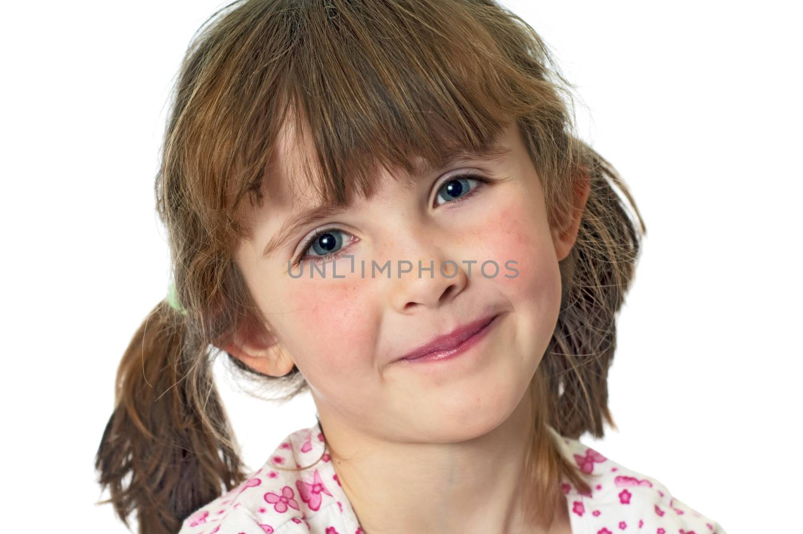 A cute little girl showing her lips after applying gloss to them.