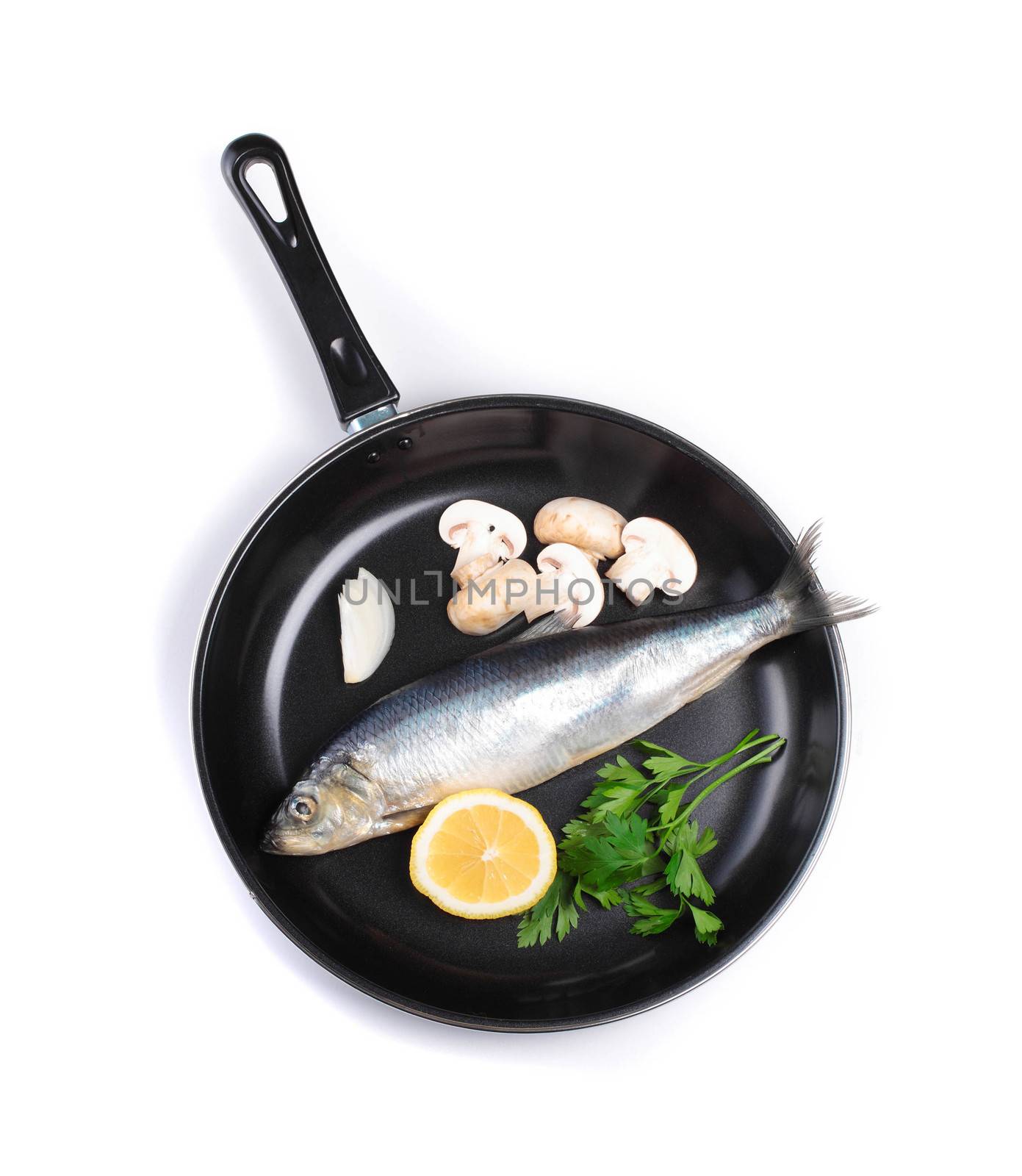 fish in pan with vegetables