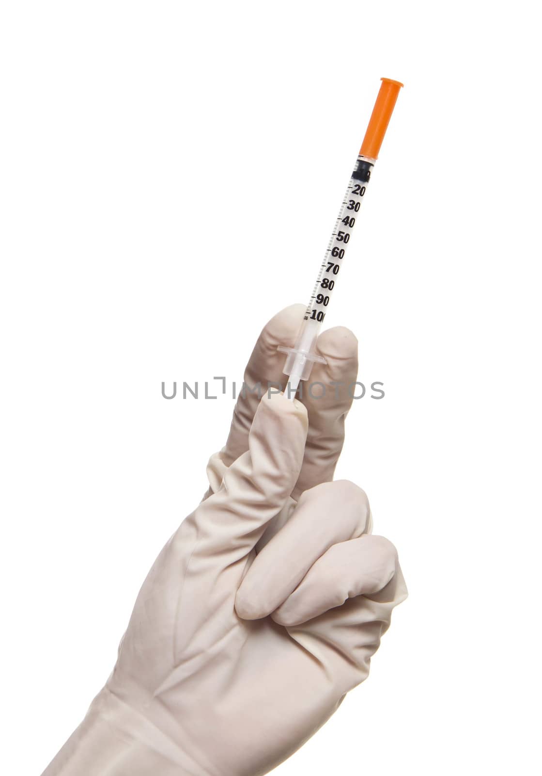 Hand holding syringe isolated on white