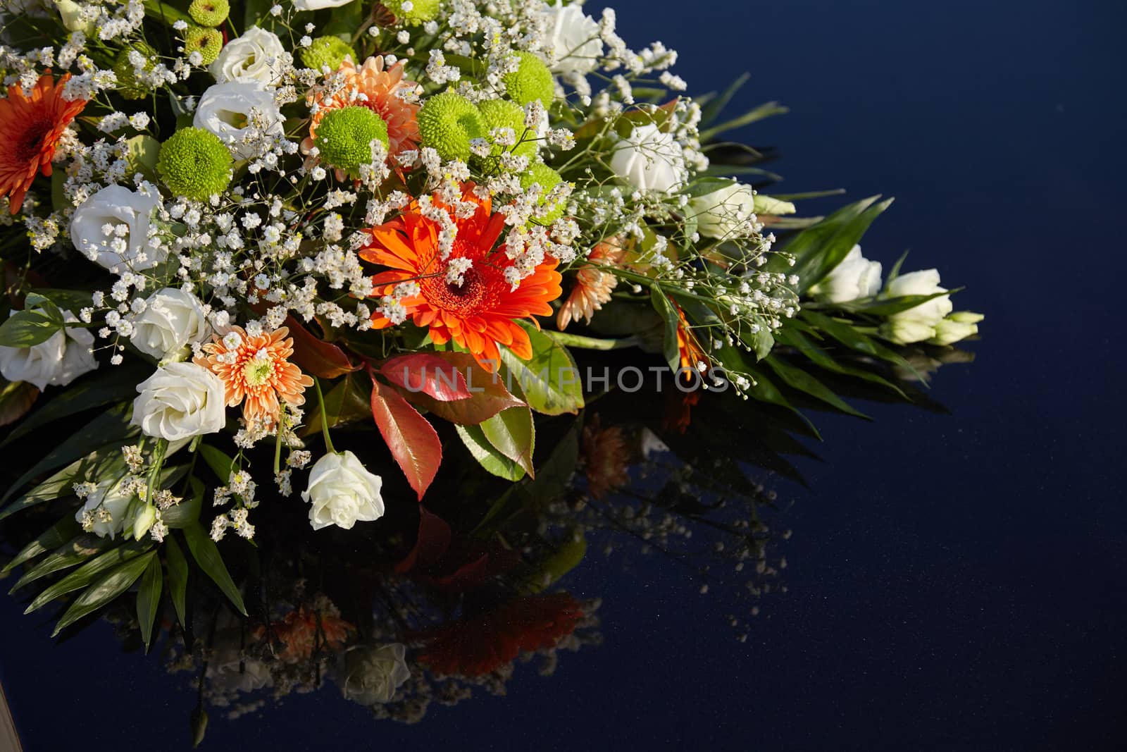 The wedding car decorated with flowers