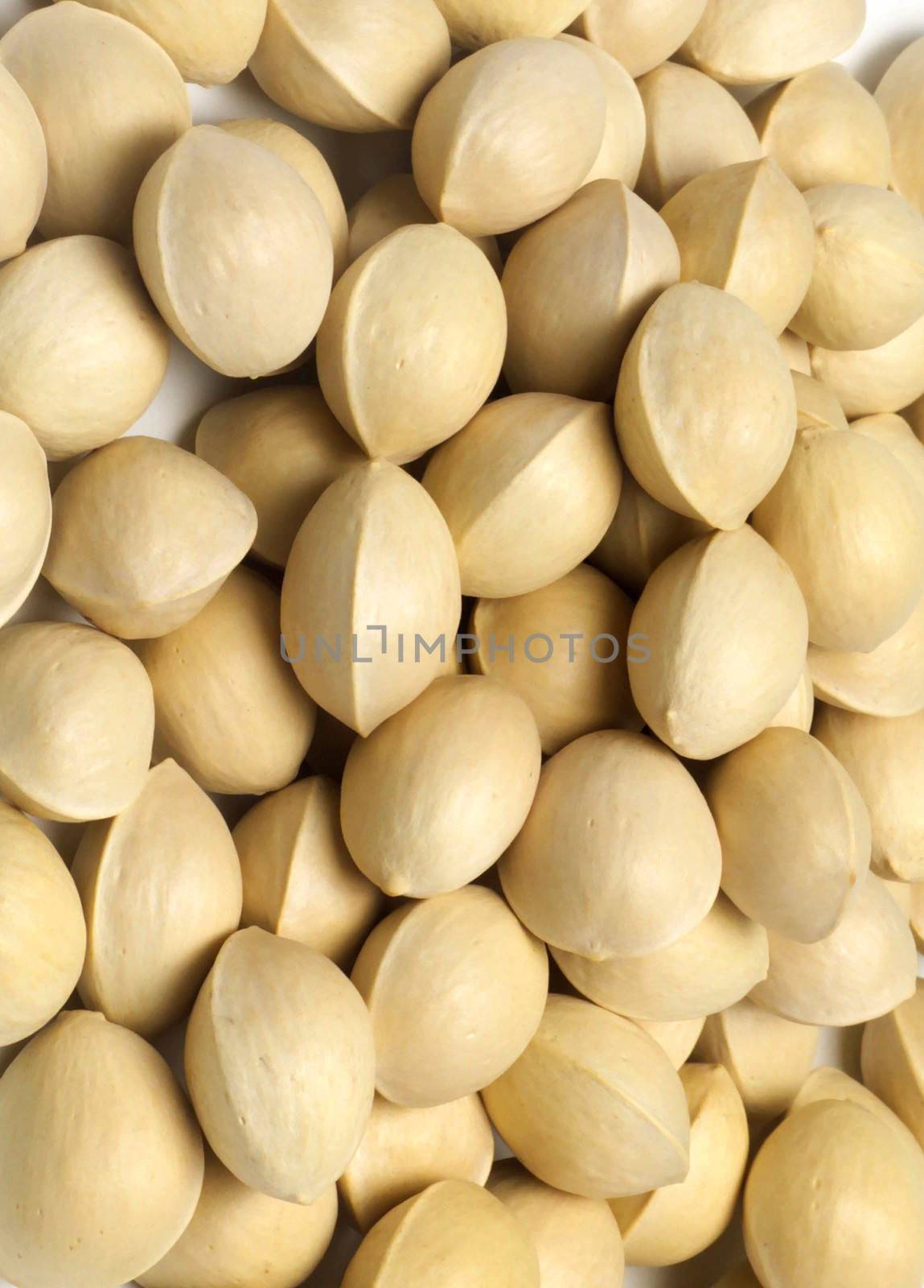 many pistachios isolated on a white background by shutswis