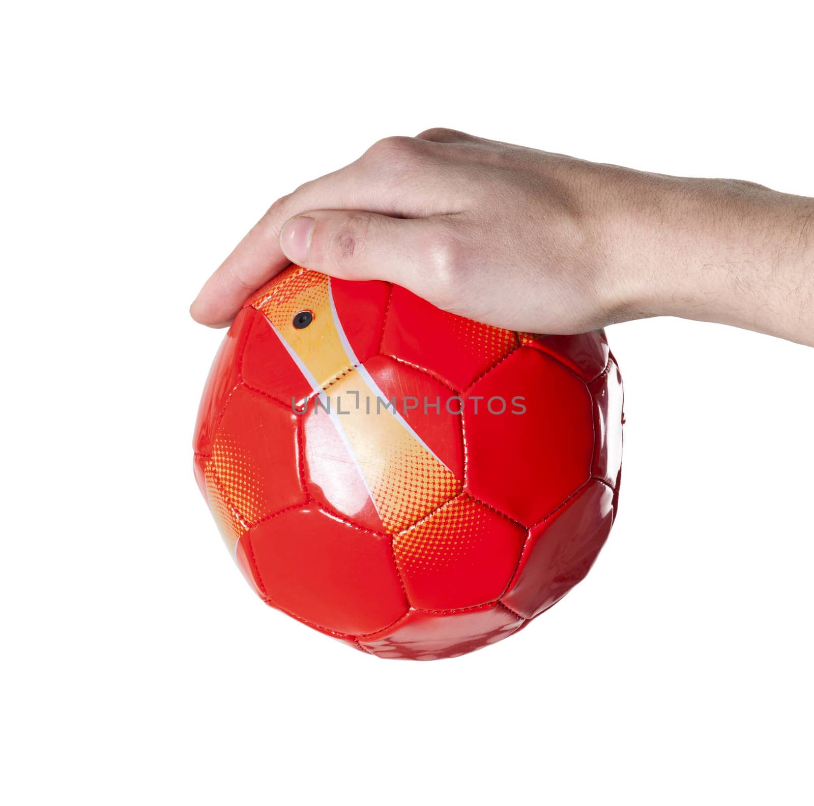 small soccer red ball in hand. Isolated by shutswis