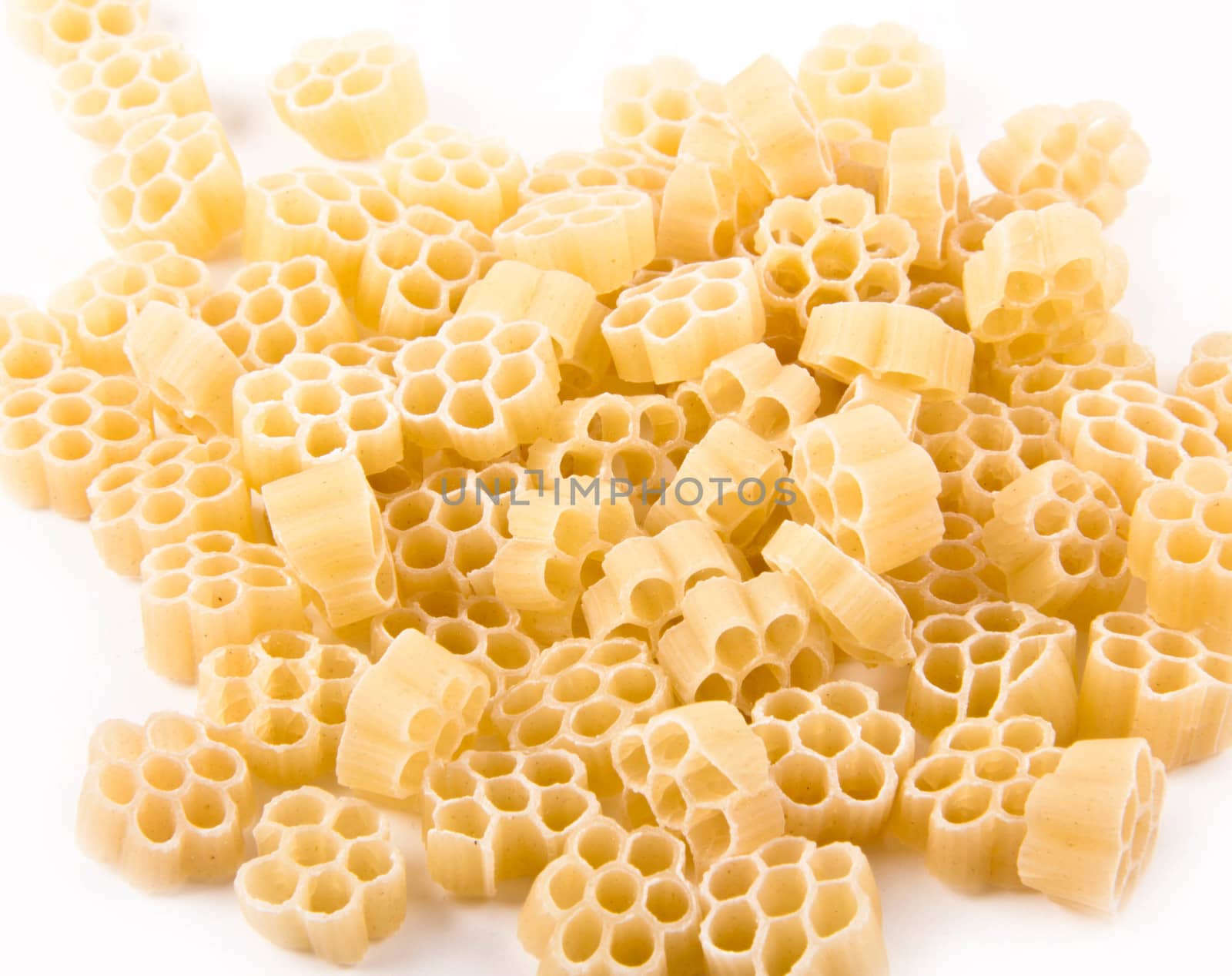 Raw pasta isolated on white