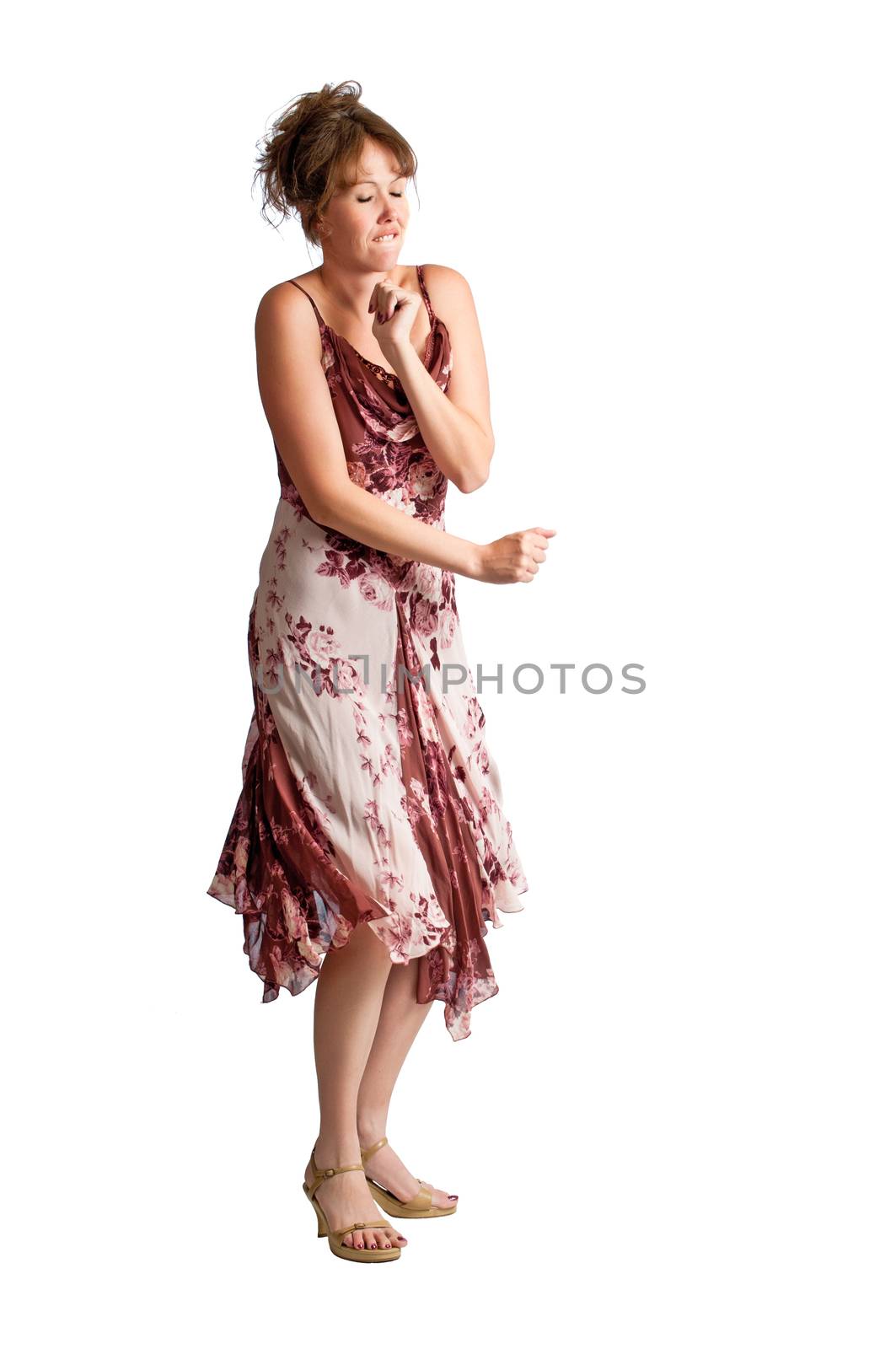 Pretty brunette woman dancing isolated against a pure white background
