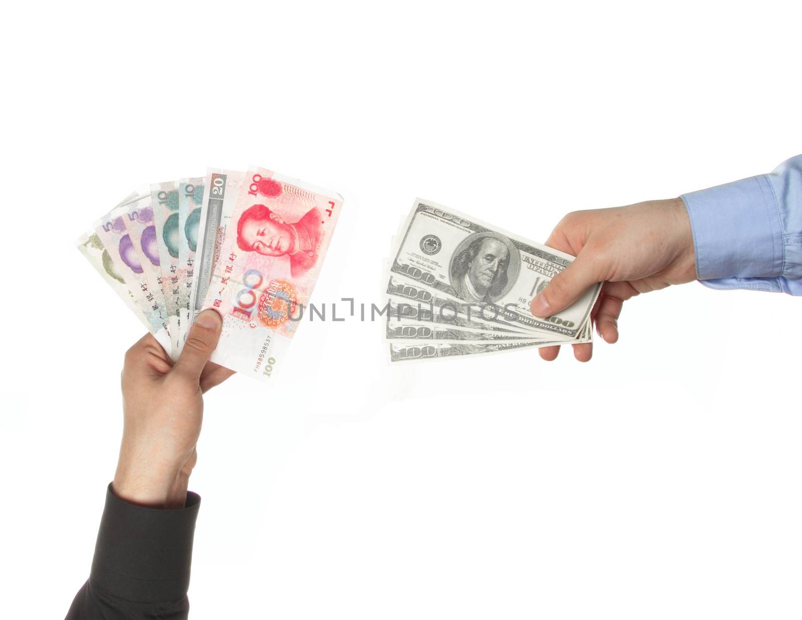 Hands holding yuan and dollar bills
