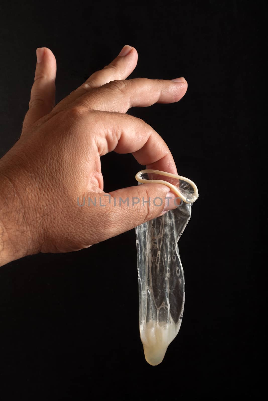 Used condom with sperm by Portokalis