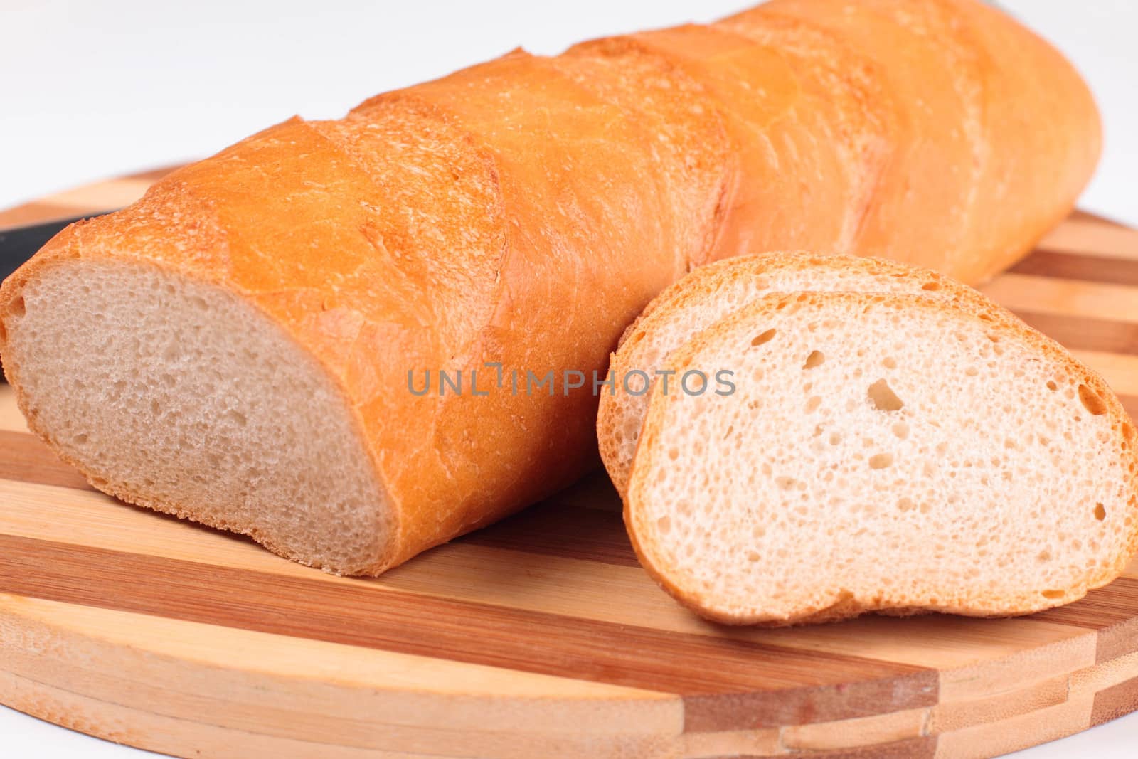 sliced fresh bread on board