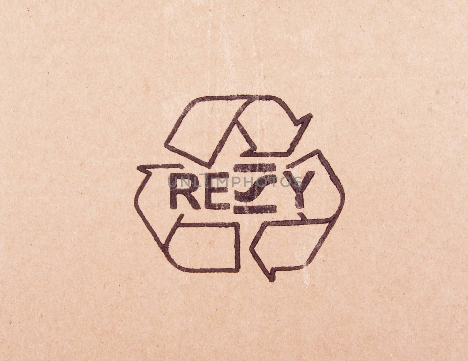 torn out piece of cardboard with recycle symbol