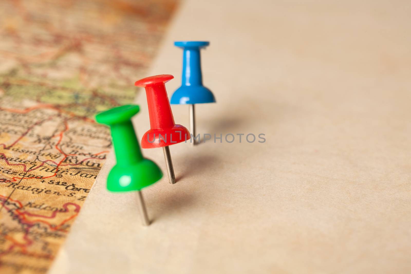 Push pins showing the location of a destination point on a map. Ready for your message.