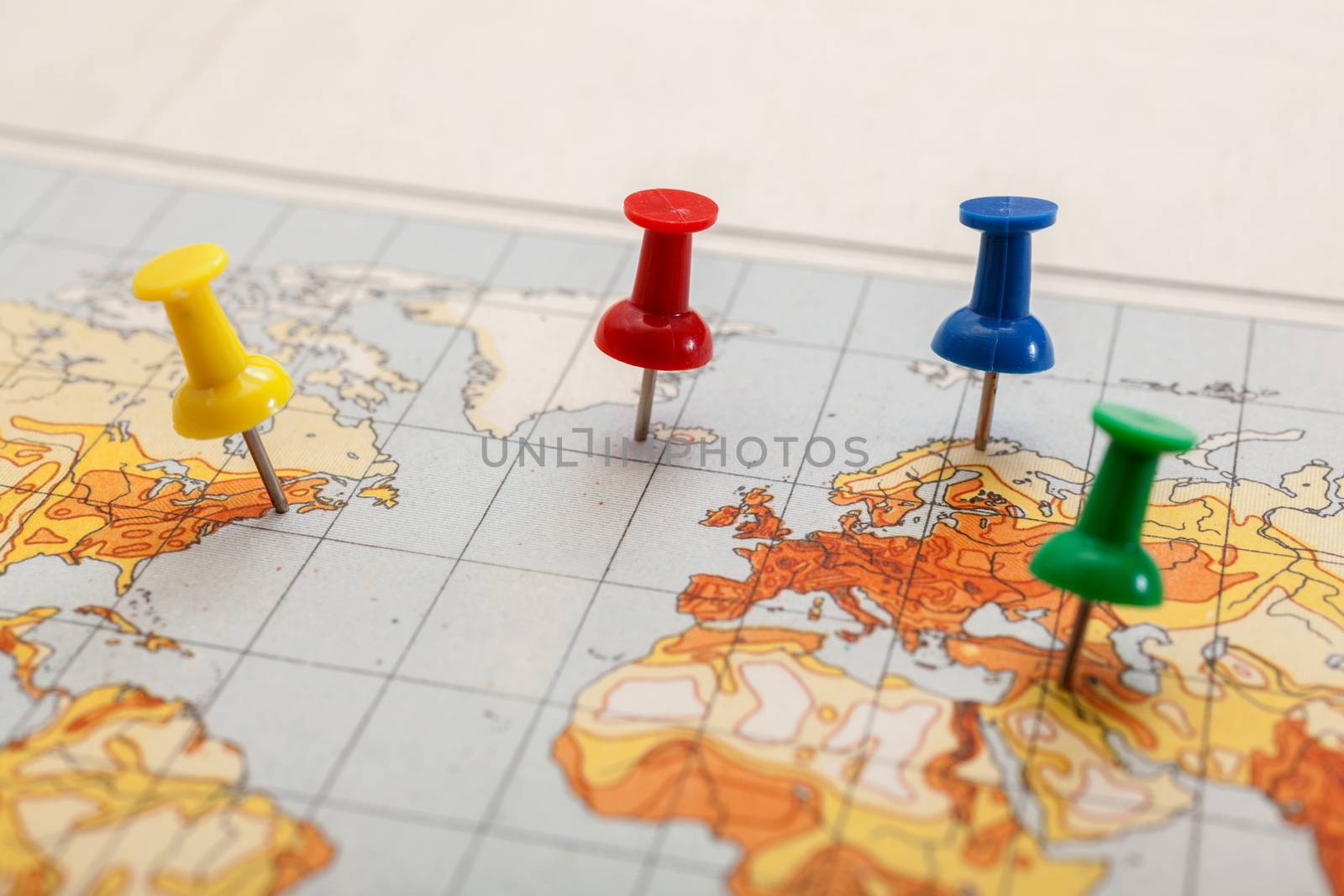 Push pins showing the location of a destination point on a temperature map