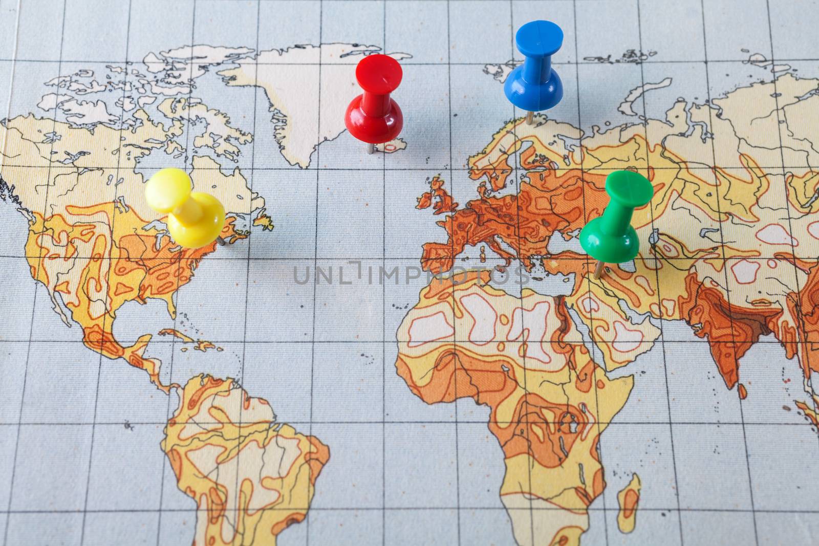 Push pins showing the location of a destination point on a temperature map