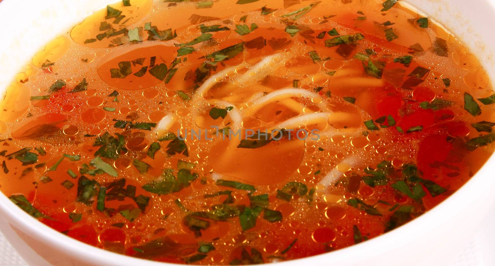 Bowl of Bright Red Creamy Tomato Soup with Yogurt