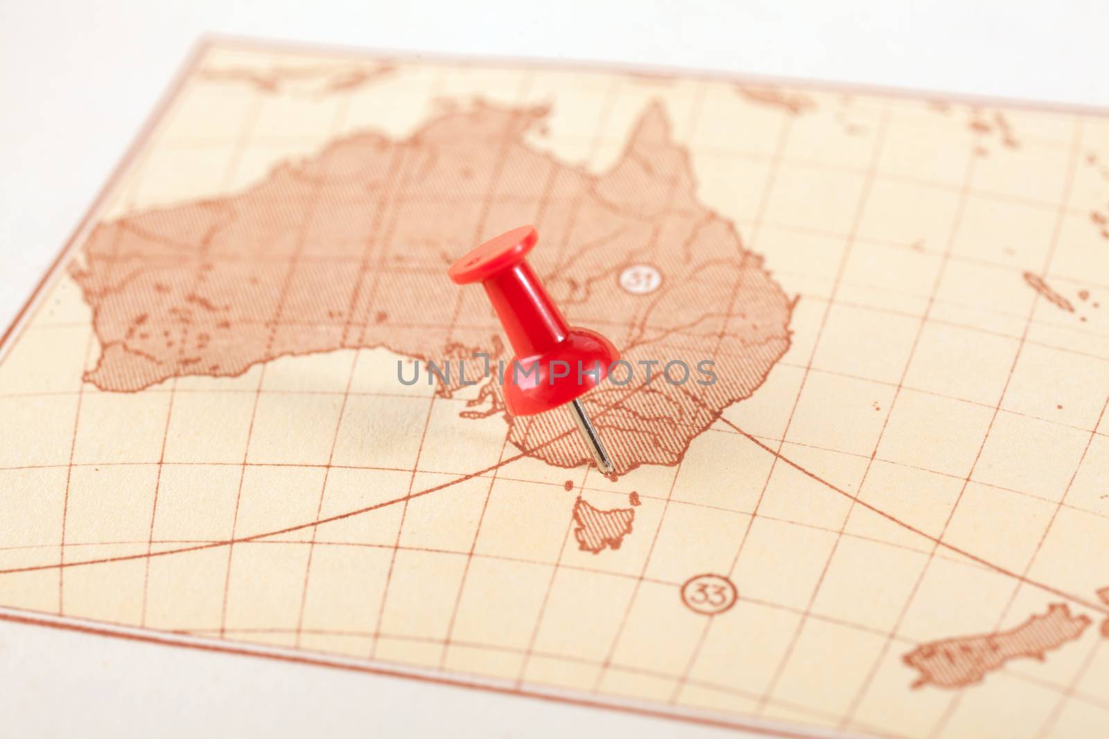 Red push pin showing the location of a destination point on a map. Australia